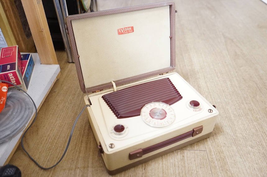 A Bolex Paillard 8mm cinefilm projector, a 1960s slide projector and a vintage radio. Condition - varies